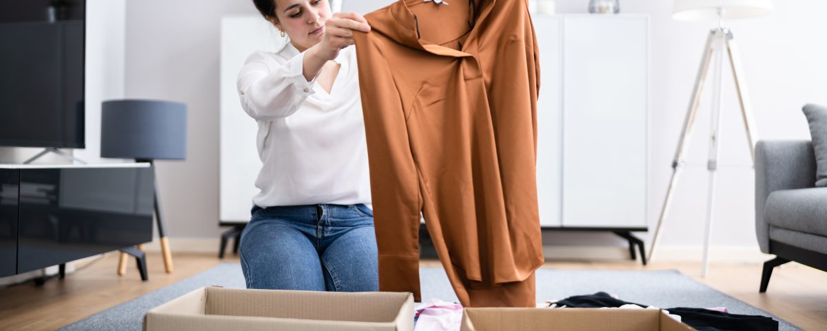 Woman Decluttering Clothes