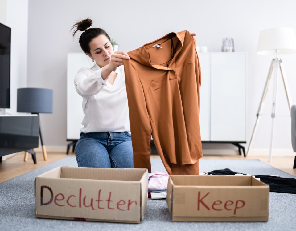 Woman Decluttering Clothes